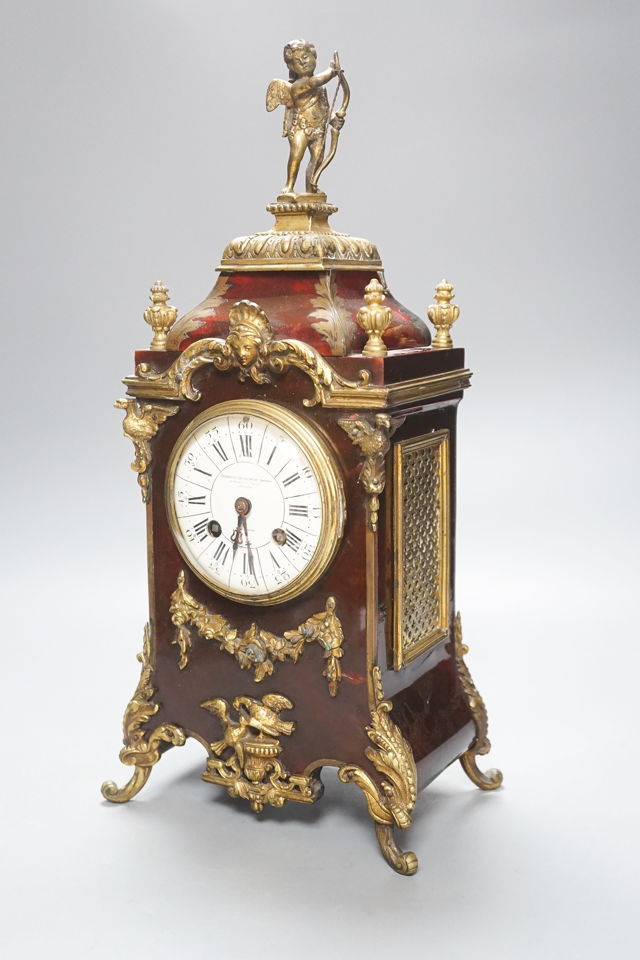 A 19th century French tortoiseshell and gilt metal mounted clock with key and pendulum 40cm